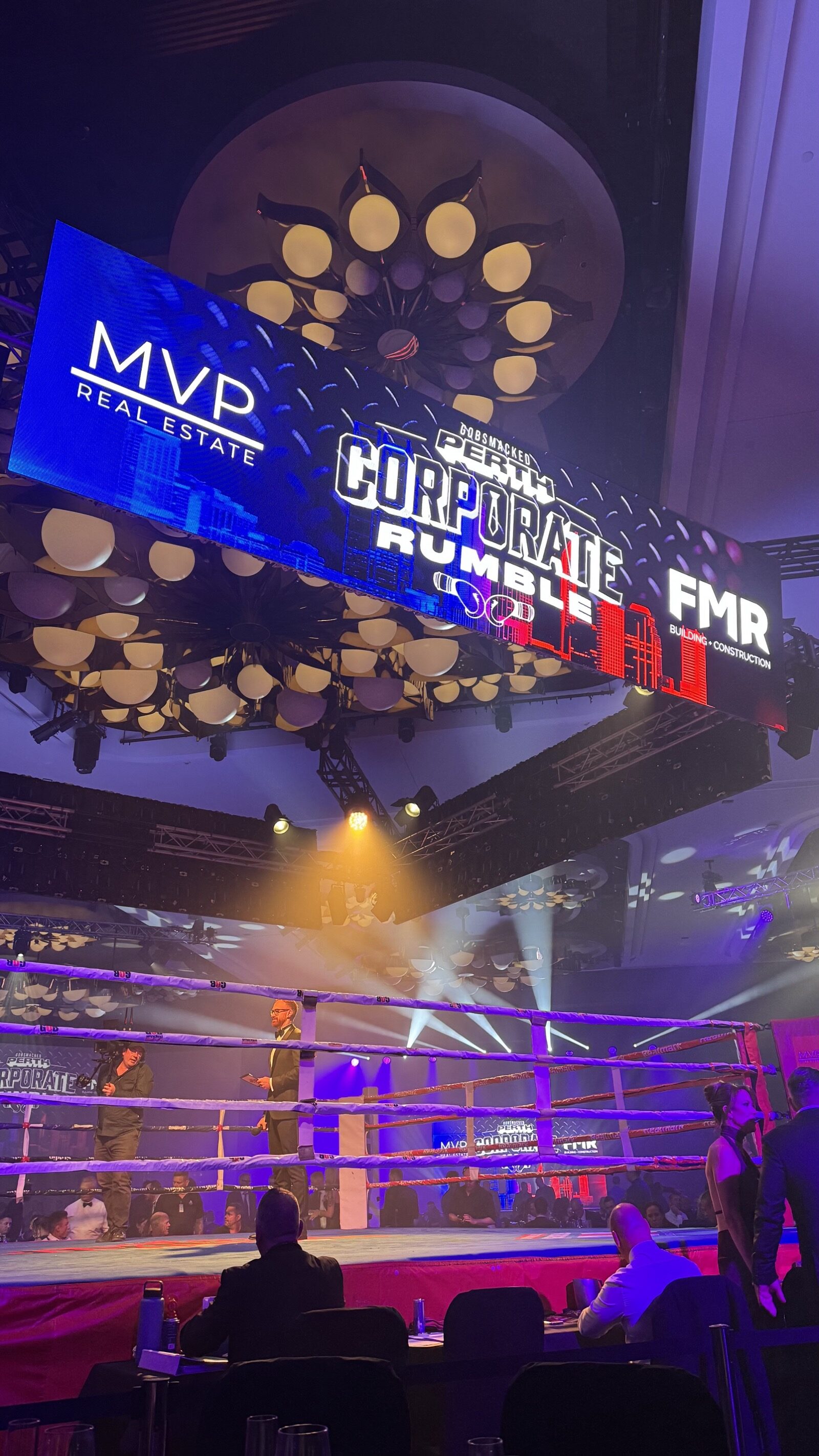 FMR and Corporate Rumble branding above the boxing ring